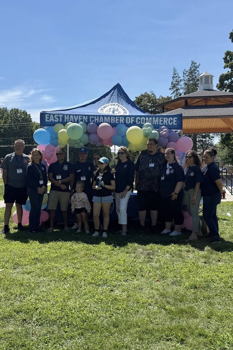 Ma'ayan holding her Young Entrepreneur Award trophy with the East Haven Chamber of Commerce