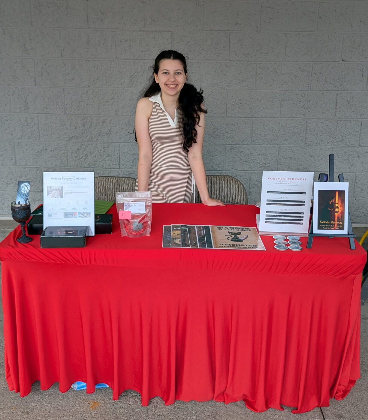 Ma'ayan at an outdoor community market table